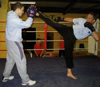 Norman Kelly working out at his gym with student Thomas Bateman Norman Kelly working out at his gym with student Thomas Bateman